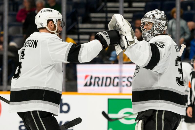 Nov 4, 2024; Nashville, Tennessee, USA;  Los Angeles Kings defenseman Joel Edmundson (6) congratulates goaltender Darcy Kuemper (35) on the shut out against the Nashville Predators during the third period at Bridgestone Arena. Mandatory Credit: Steve Roberts-Imagn Images