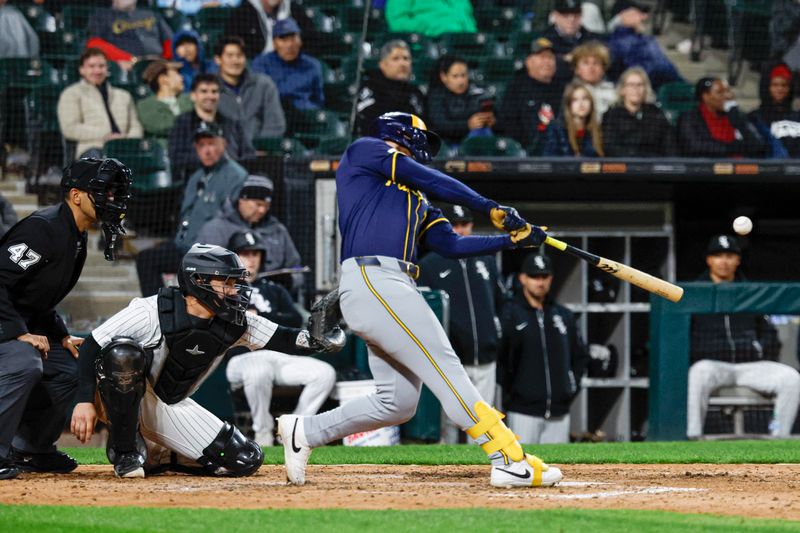 Apr 30, 2025; Chicago, Illinois, USA; Milwaukee Brewers left fielder Jake Bauers (9) hits a two-run double against the Chicago White Sox during the eight inning at Rate Field. Mandatory Credit: Kamil Krzaczynski-Imagn Images