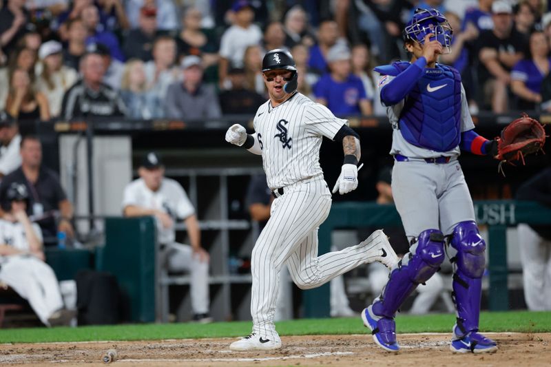 Aug 9, 2024; Chicago, Illinois, USA; Chicago White Sox catcher Korey Lee (26) scores against the Chicago Cubs during the fourth inning at Guaranteed Rate Field. Mandatory Credit: Kamil Krzaczynski-USA TODAY Sports