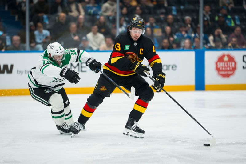 Nov 20, 2025; Vancouver, British Columbia, CAN; Dallas Stars forward Colin Blackwell (15) battles with Vancouver Canucks defenseman Quinn Hughes (43) in the second period at Rogers Arena. Mandatory Credit: Bob Frid-Imagn Images