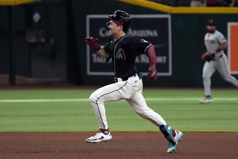 Sep 17, 2025; Phoenix, Arizona, USA; Arizona Diamondbacks outfielder Corbin Carroll (7) hits a triple against the San Francisco Giants in the ninth inning at Chase Field. Mandatory Credit: Rick Scuteri-Imagn Images