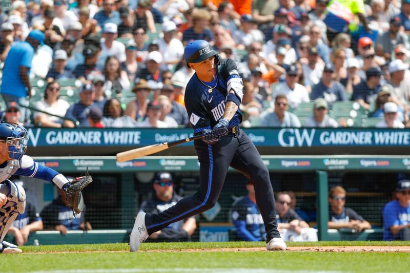 May 26, 2024; Detroit, Michigan, USA; Detroit Tigers third baseman Gio Urshela (13) singles during the first inning of the game against the Toronto Blue Jays at Comerica Park. Mandatory Credit: Brian Bradshaw Sevald-USA TODAY Sports