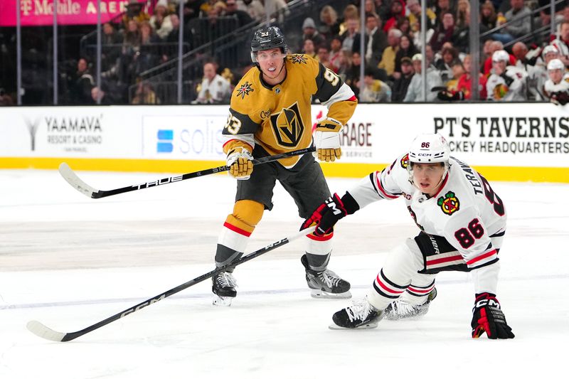 Dec 2, 2025; Las Vegas, Nevada, USA; Chicago Blackhawks center Teuvo Teravainen (86) defends against Vegas Golden Knights right wing Mitch Marner (93) during a second period power play at T-Mobile Arena. Mandatory Credit: Stephen R. Sylvanie-Imagn Images