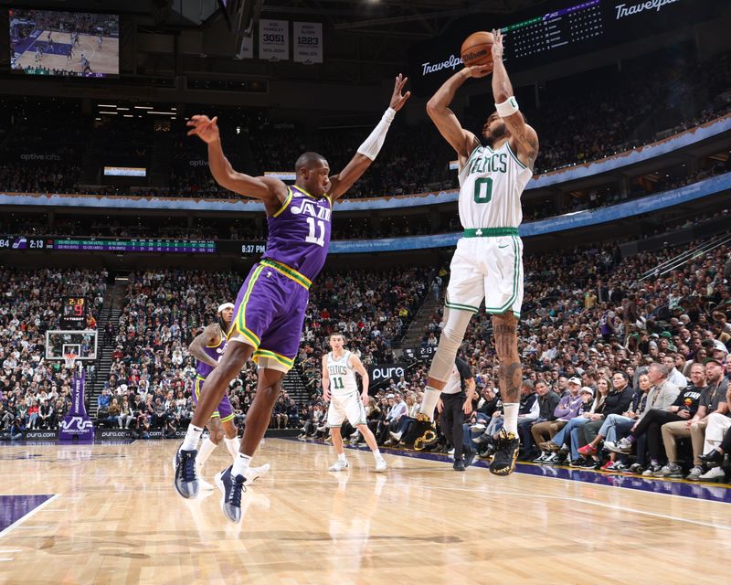 SALT LAKE CITY, UT - MARCH 12:  Jayson Tatum #0 of the Boston Celtics shoots the ball during the game  against Kris Dunn #11 of the Utah Jazz on March 12, 2024 at Delta Center in Salt Lake City, Utah. NOTE TO USER: User expressly acknowledges and agrees that, by downloading and or using this Photograph, User is consenting to the terms and conditions of the Getty Images License Agreement. Mandatory Copyright Notice: Copyright 2024 NBAE (Photo by Melissa Majchrzak/NBAE via Getty Images)