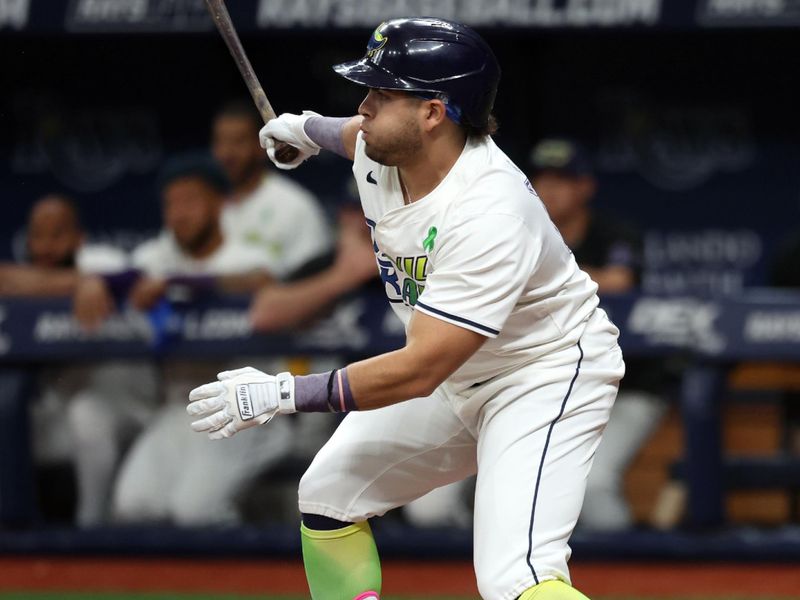 May 24, 2024; St. Petersburg, Florida, USA;  Tampa Bay Rays second base Jonathan Aranda (62) hits an RBI against the Kansas City Royals during the first inning at Tropicana Field. Mandatory Credit: Kim Klement Neitzel-USA TODAY Sports