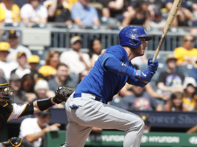 Aug 27, 2023; Pittsburgh, Pennsylvania, USA;  Chicago Cubs designated hitter Cody Bellinger (24) hits an RBI single against the Pittsburgh Pirates during the first inning at PNC Park. Mandatory Credit: Charles LeClaire-USA TODAY Sports