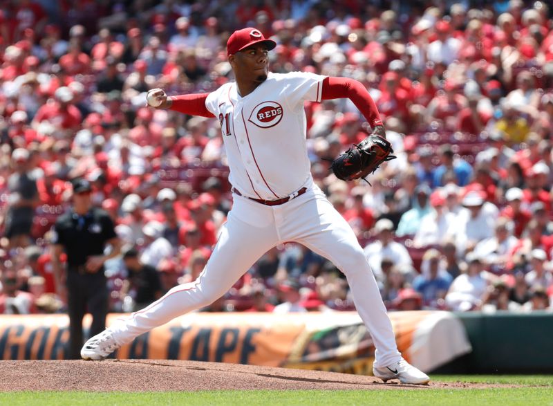 Aug 20, 2023; Cincinnati, Ohio, USA; Cincinnati Reds starting pitcher Hunter Greene (21) throws against the Toronto Blue Jays during the first inning at Great American Ball Park. Mandatory Credit: David Kohl-USA TODAY Sports