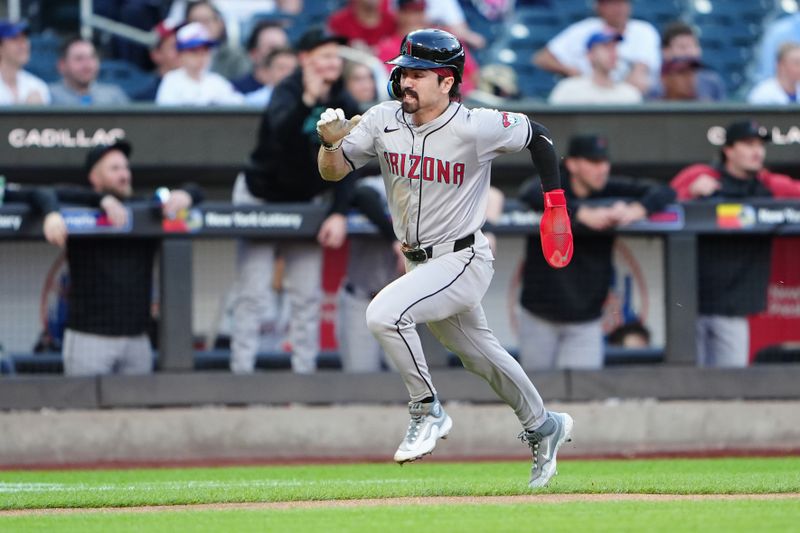 May 31, 2024; New York City, New York, USA; Arizona Diamondbacks center fielder Corbin Carroll (7) scores a run on designated hitter Joc Pederson (not pictured) RBI single against the New York Mets during the first inning at Citi Field. Mandatory Credit: Gregory Fisher-USA TODAY Sports