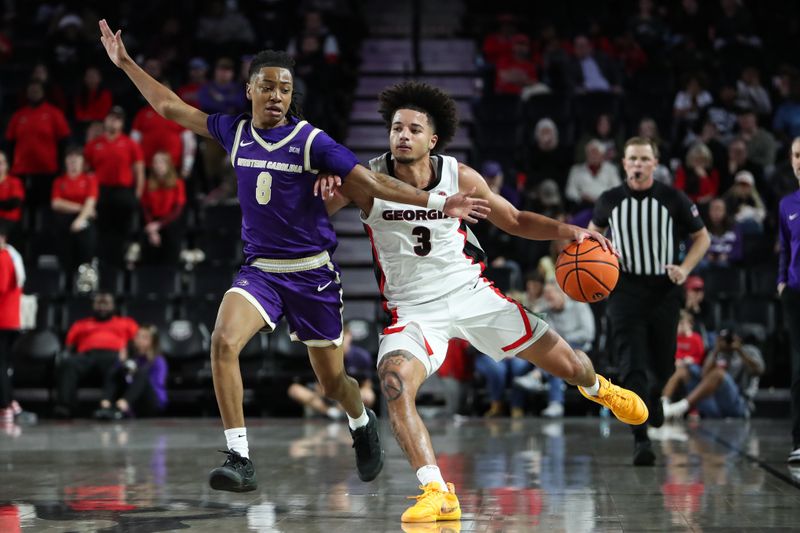 Dec 18, 2025; Athens, Georgia, USA; Georgia Bulldogs guard Jordan Ross (3) dribbles past Western Carolina Catamounts guard Tahlan Pettway (8) in the second half at Stegeman Coliseum. Mandatory Credit: Mady Mertens-Imagn Images