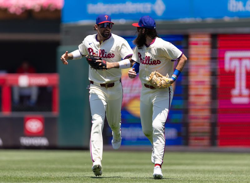 Jun 19, 2024; Philadelphia, Pennsylvania, USA; Philadelphia Phillies outfielder Nick Castellanos (8) and outfielder Brandon Marsh (16) react together after an out to end the top of the first inning against the San Diego Padres at Citizens Bank Park. Mandatory Credit: Bill Streicher-USA TODAY Sports