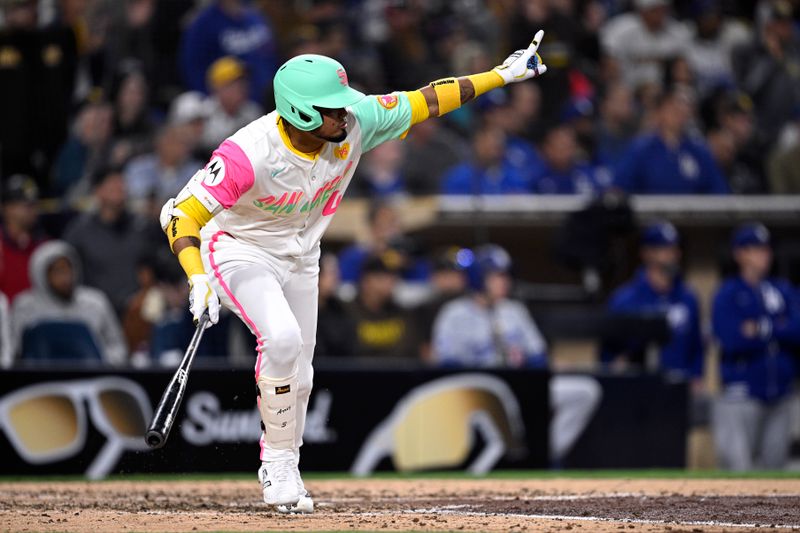 May 10, 2024; San Diego, California, USA; San Diego Padres designated hitter Luis Arraez (4) celebrates after hitting a walk-off single against the Los Angeles Dodgers at Petco Park. Mandatory Credit: Orlando Ramirez-USA TODAY Sports