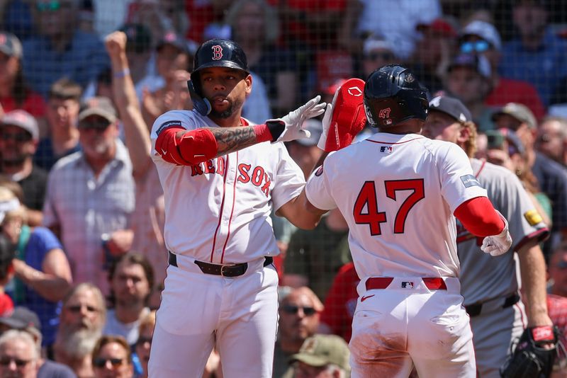 Jun 5, 2024; Boston, Massachusetts, USA; Boston Red Sox second baseman Enmanuel Valdez (47) high fives Boston Red Sox first baseman Dominic Smith (2) after scoring during the fifth inning against the Atlanta Braves at Fenway Park. Mandatory Credit: Paul Rutherford-USA TODAY Sports