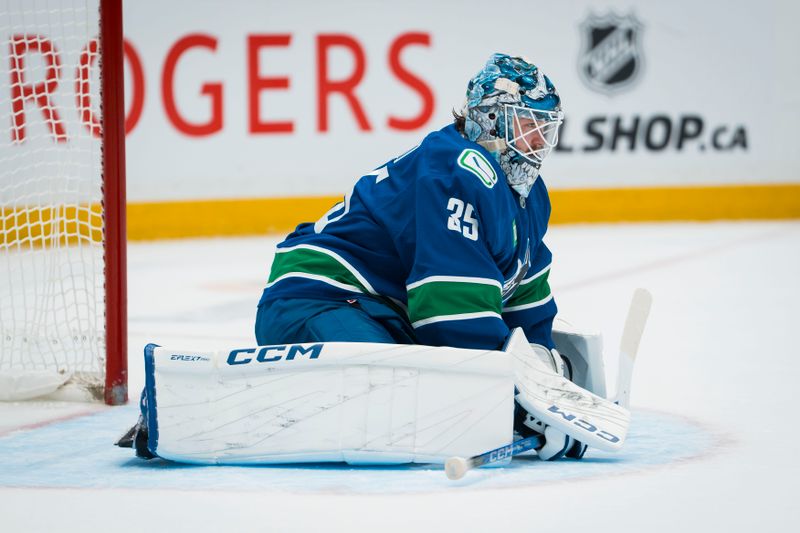 Nov 11, 2025; Vancouver, British Columbia, CAN; Vancouver Canucks goalie Thatcher Demko (35) during a stop in play against the Winnipeg Jets in the first period at Rogers Arena. Mandatory Credit: Bob Frid-Imagn Images