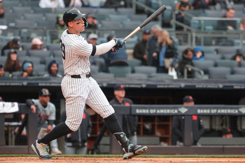 May 5, 2024; Bronx, New York, USA; New York Yankees center fielder Aaron Judge (99) hits a solo home run during the first inning against the Detroit Tigers at Yankee Stadium. Mandatory Credit: Vincent Carchietta-USA TODAY Sports