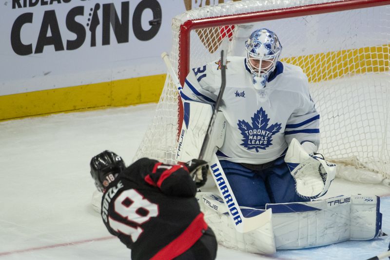 Dec 7, 2023; Ottawa, Ontario, CAN; Toronto Maple Leafs goalie Martin Jones (31) makes a save on a shot from  Ottawa Senators center Tim Stutzle (18) in the third period at the Canadian Tire Centre. Mandatory Credit: Marc DesRosiers-USA TODAY Sports