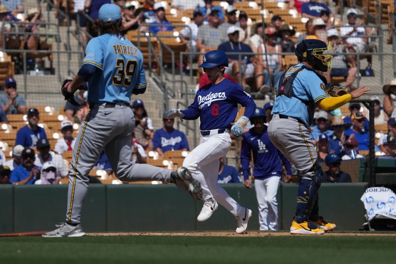 Mar 16, 2026; Phoenix, Arizona, USA; Los Angeles Dodgers second baseman Hyeseong Kim (6) scores a run against the Milwaukee Brewers in the second inning at Camelback Ranch-Glendale. Mandatory Credit: Rick Scuteri-Imagn Images