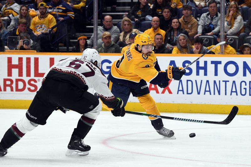 Feb 10, 2024; Nashville, Tennessee, USA; Nashville Predators left wing Filip Forsberg (9) shoots the puck during the third period against the Arizona Coyotes at Bridgestone Arena. Mandatory Credit: Christopher Hanewinckel-USA TODAY Sports