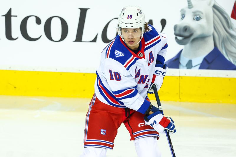 Oct 26, 2025; Calgary, Alberta, CAN; New York Rangers left wing Artemi Panarin (10) skates during the warmup period against the Calgary Flames at Scotiabank Saddledome. Mandatory Credit: Sergei Belski-Imagn Images