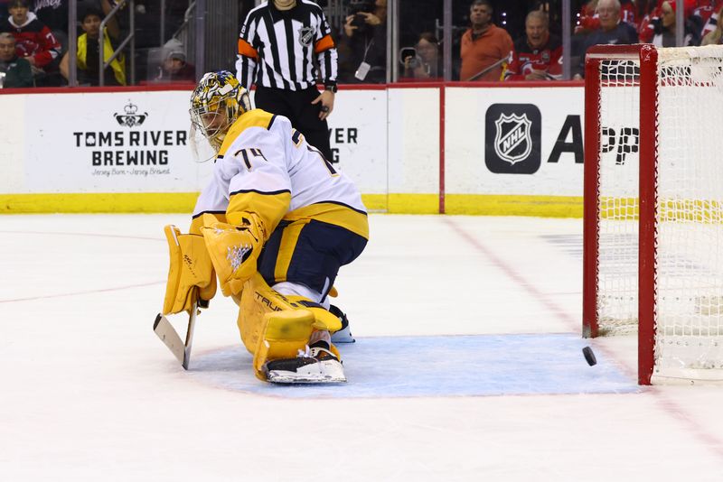 Nov 25, 2024; Newark, New Jersey, USA; New Jersey Devils center Nico Hischier (13) (not shown) scores a goal against the Nashville Predators during the second period at Prudential Center. Mandatory Credit: Ed Mulholland-Imagn Images