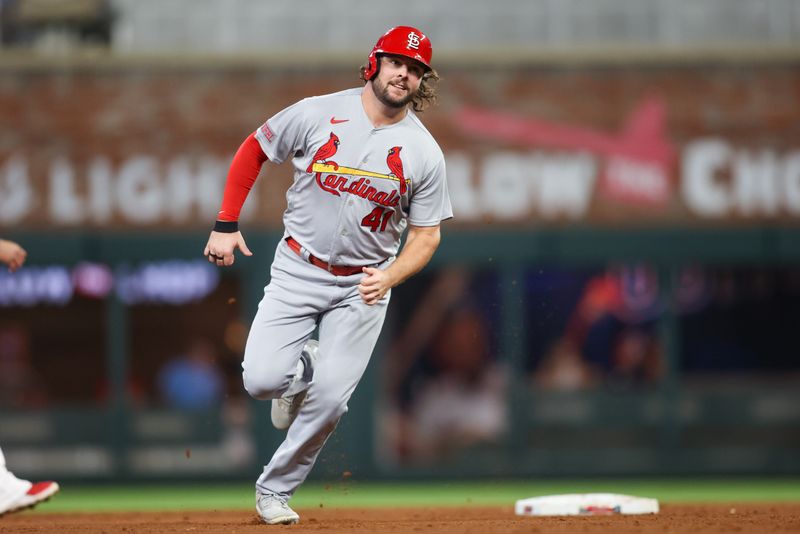 Sep 7, 2023; Atlanta, Georgia, USA; St. Louis Cardinals left fielder Alec Burleson (41) runs to third against the Atlanta Braves in the ninth inning at Truist Park. Mandatory Credit: Brett Davis-USA TODAY Sports