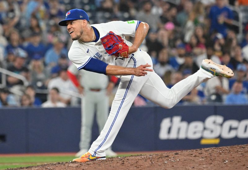 Jun 4, 2025; Toronto, Ontario, CAN;  Toronto Blue Jays starting pitcher Jose Berrios (17) delivers a pitch against the Philadelphia Phillies in the fifth inning at Rogers Centre. Mandatory Credit: Dan Hamilton-Imagn Images