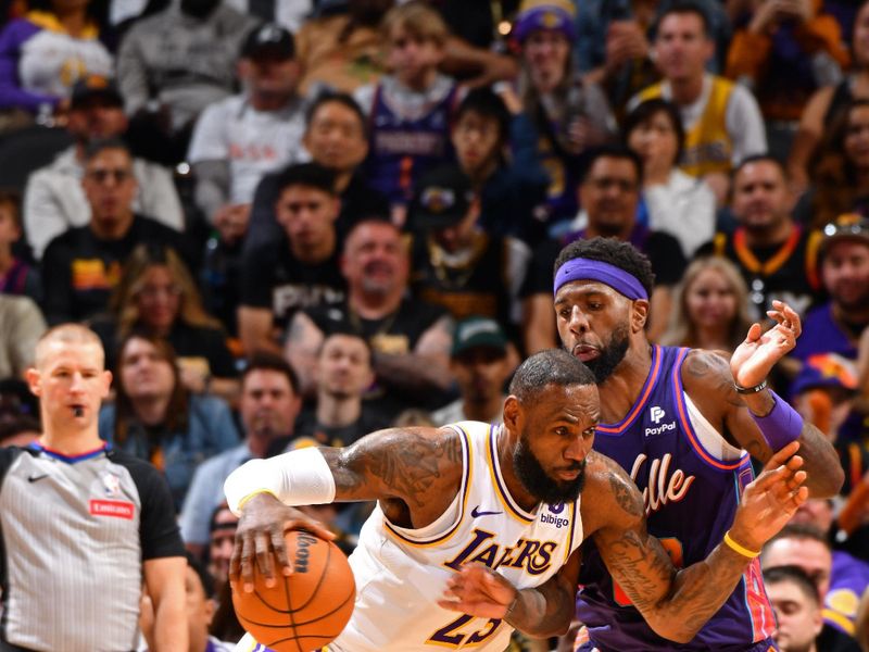 PHOENIX, AZ - FEBRUARY 25: LeBron James #23 of the Los Angeles Lakers handles the ball during the game against the Phoenix Suns on February 25, 2024 at Footprint Center in Phoenix, Arizona. NOTE TO USER: User expressly acknowledges and agrees that, by downloading and or using this photograph, user is consenting to the terms and conditions of the Getty Images License Agreement. Mandatory Copyright Notice: Copyright 2024 NBAE (Photo by Barry Gossage/NBAE via Getty Images)