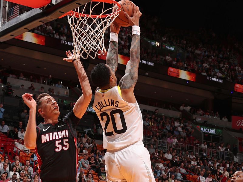 MIAMI, FL - MARCH 2: John Collins #20 of the Utah Jazz dunks the ball during the game against the Miami Heat on March 2, 2024 at Kaseya Center in Miami, Florida. NOTE TO USER: User expressly acknowledges and agrees that, by downloading and or using this Photograph, user is consenting to the terms and conditions of the Getty Images License Agreement. Mandatory Copyright Notice: Copyright 2024 NBAE (Photo by Issac Baldizon/NBAE via Getty Images)