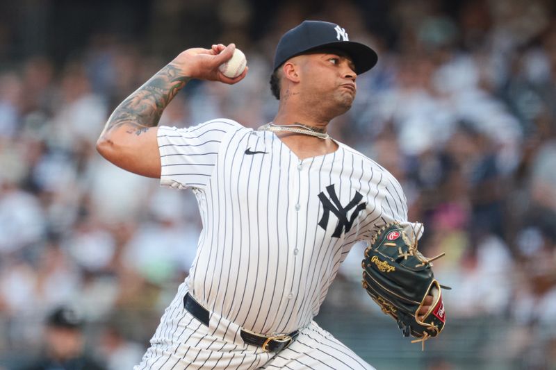 Jul 7, 2024; Bronx, New York, USA; New York Yankees starting pitcher Luis Gil (81) delivers a pitch during the first inning against the Boston Red Sox at Yankee Stadium. Mandatory Credit: Vincent Carchietta-USA TODAY Sports