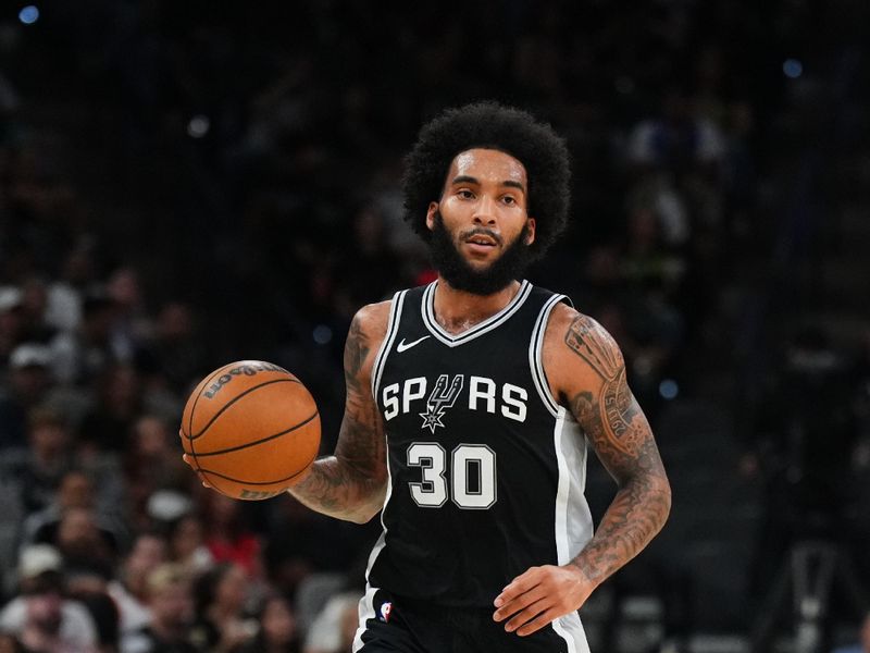 SAN ANTONIO, TX - NOVEMBER 2: Julian Champagnie #30 of the San Antonio Spurs dribbles the ball during the game against the Minnesota Timberwolves on November 2, 2024 at the Frost Bank Center in San Antonio, Texas. NOTE TO USER: User expressly acknowledges and agrees that, by downloading and or using this photograph, user is consenting to the terms and conditions of the Getty Images License Agreement. Mandatory Copyright Notice: Copyright 2024 NBAE (Photos by Cooper Neill/NBAE via Getty Images)