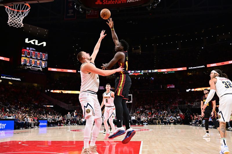 ATLANTA, GA - DECEMBER 8: Clint Capela #15 of the Atlanta Hawks shoots the ball during the game against the Denver Nuggets on December 8, 2024 at State Farm Arena in Atlanta, Georgia.  NOTE TO USER: User expressly acknowledges and agrees that, by downloading and/or using this Photograph, user is consenting to the terms and conditions of the Getty Images License Agreement. Mandatory Copyright Notice: Copyright 2024 NBAE (Photo by Adam Hagy/NBAE via Getty Images)