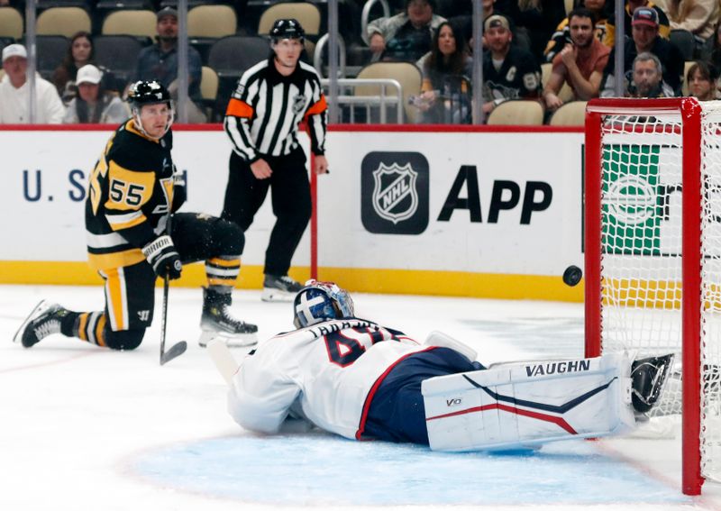 Oct 4, 2024; Pittsburgh, Pennsylvania, USA;  Pittsburgh Penguins center Noel Acciari (55) scores a goal against Columbus Blue Jackets goaltender Daniil Tarasov (40) during the first period at PPG Paints Arena. Mandatory Credit: Charles LeClaire-Imagn Images