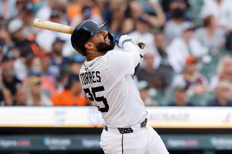 Jun 26, 2025; Detroit, Michigan, USA;  Detroit Tigers second base Gleyber Torres (25) hits a two run home run in the seventh inning against the Athletics at Comerica Park. Mandatory Credit: Rick Osentoski-Imagn Images