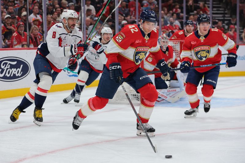 Nov 13, 2025; Sunrise, Florida, USA; Florida Panthers defenseman Gustav Forsling (42) moves the puck against the Washington Capitals during the first period at Amerant Bank Arena. Mandatory Credit: Sam Navarro-Imagn Images