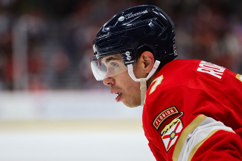 Nov 12, 2024; Sunrise, Florida, USA; Florida Panthers center Evan Rodrigues (17) looks on against the New Jersey Devils during the second period at Amerant Bank Arena. Mandatory Credit: Sam Navarro-Imagn Images