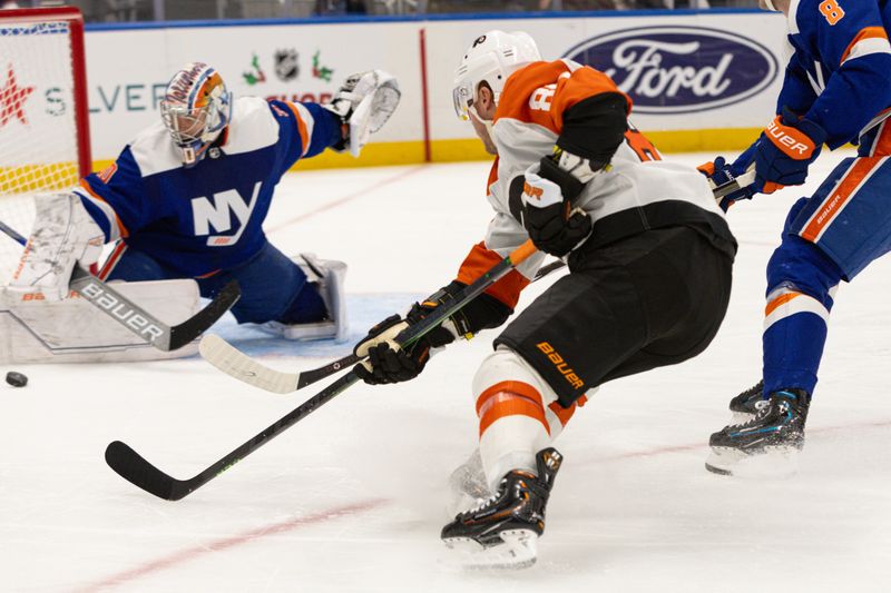 Nov 25, 2023; Elmont, New York, USA; Philadelphia Flyers left wing Joel Farabee (86) takes a shot against the New York Islanders during the third period at UBS Arena. Mandatory Credit: Thomas Salus-USA TODAY Sports