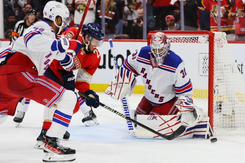 May 26, 2024; Sunrise, Florida, USA; New York Rangers goaltender Igor Shesterkin (31) makes a save against the Florida Panthers during the third period in game three of the Eastern Conference Final of the 2024 Stanley Cup Playoffs at Amerant Bank Arena. Mandatory Credit: Sam Navarro-USA TODAY Sports