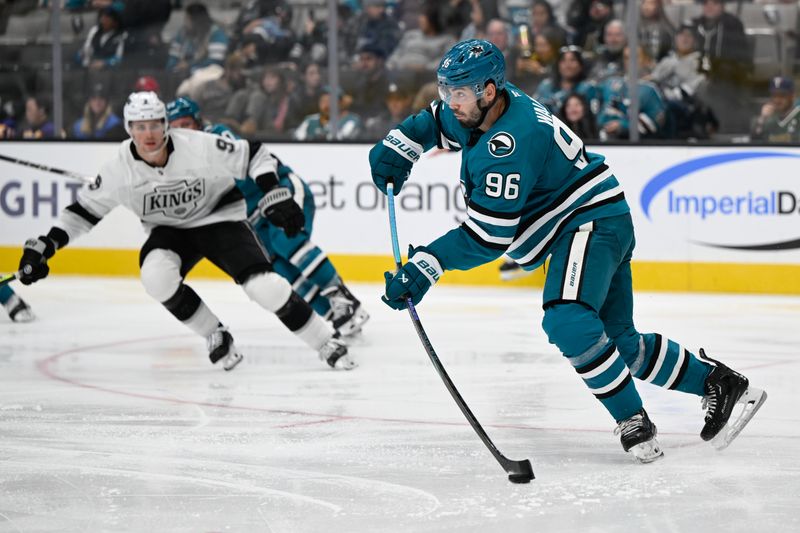 Oct 29, 2024; San Jose, California, USA; San Jose Sharks defenseman Jake Walman (96) passes the puck against the Los Angeles Kings in the third period at SAP Center at San Jose. Mandatory Credit: Eakin Howard-Imagn Images