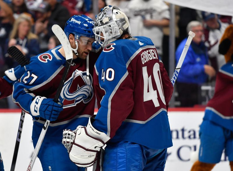 Oct 21, 2023; Denver, Colorado, USA; Colorado Avalanche left wing Jonathan Drouin (27) congratulates Colorado Avalanche goaltender Alexandar Georgiev (40) after their win over th eCarolina Hurricanes at Ball Arena. Mandatory Credit: John Leyba-USA TODAY Sports