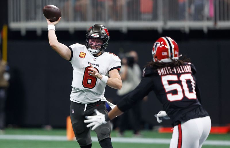 Tampa Bay Buccaneers quarterback Baker Mayfield (6) throws a pass against the Atlanta Falcons during the second half of an NFL football game Thursday, Oct. 3, 2024, in Atlanta. (AP Photo/Butch Dill)