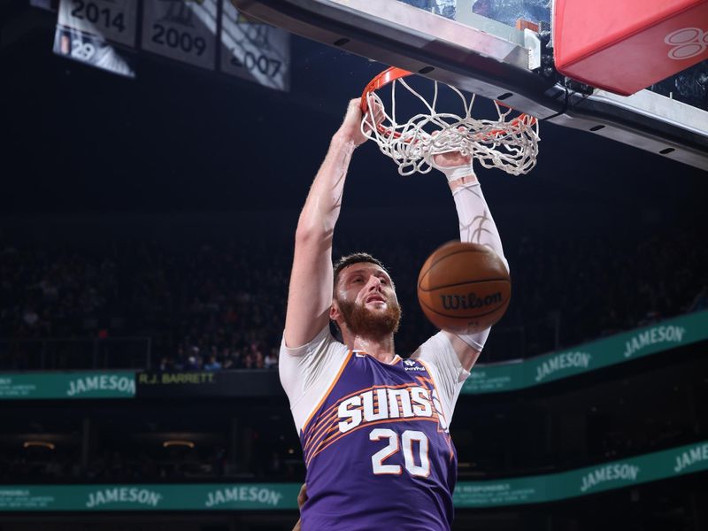 PHOENIX, AZ - MARCH 7: Jusuf Nurkic #20 of the Phoenix Suns dunks the ball during the game against the Toronto Raptors on March 7, 2024 at Footprint Center in Phoenix, Arizona. NOTE TO USER: User expressly acknowledges and agrees that, by downloading and or using this photograph, user is consenting to the terms and conditions of the Getty Images License Agreement. Mandatory Copyright Notice: Copyright 2024 NBAE (Photo by Jeff Haynes/NBAE via Getty Images)