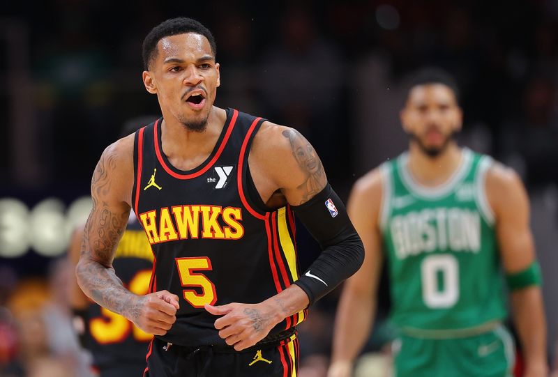 ATLANTA, GEORGIA - MARCH 28:  Dejounte Murray #5 of the Atlanta Hawks reacts after hitting a three-point basket against the Boston Celtics during the first quarter at State Farm Arena on March 28, 2024 in Atlanta, Georgia.  NOTE TO USER: User expressly acknowledges and agrees that, by downloading and/or using this photograph, user is consenting to the terms and conditions of the Getty Images License Agreement.  (Photo by Kevin C. Cox/Getty Images)