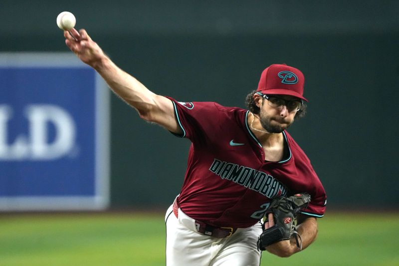 Jun 29, 2024; Phoenix, Arizona, USA; Arizona Diamondbacks pitcher Zac Gallen (23) throws against the Oakland Athletics in the first inning at Chase Field. Mandatory Credit: Rick Scuteri-USA TODAY Sports