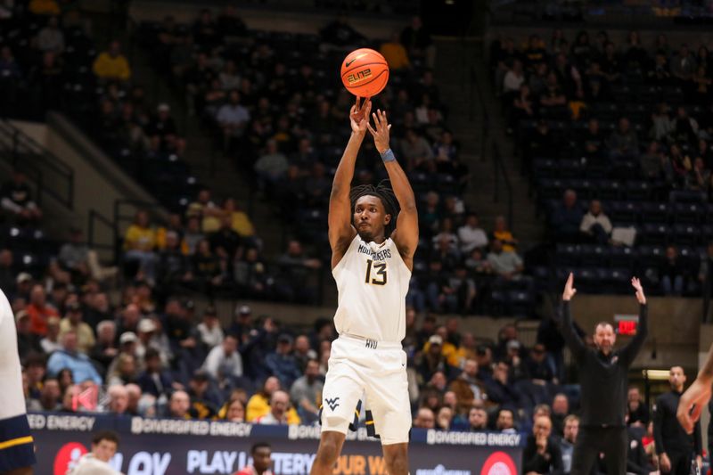 Feb 18, 2026; Morgantown, West Virginia, USA; West Virginia Mountaineers guard Chance Moore (13) shoots a three pointer during the second half against the Utah Utes at Hope Coliseum. Mandatory Credit: Ben Queen-Imagn Images