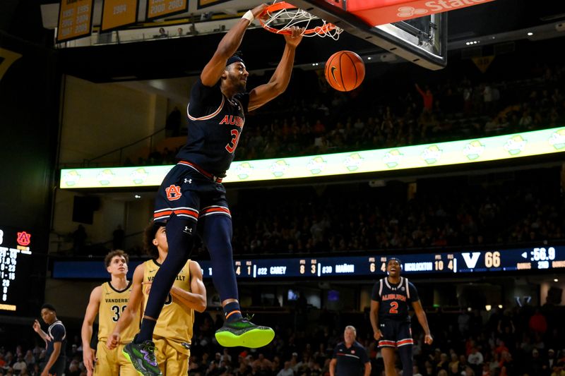 Feb 11, 2025; Nashville, Tennessee, USA; Auburn Tigers forward Jahki Howard (3) dunks the ball against the Auburn Tigers during the second half at Memorial Gymnasium. Mandatory Credit: Steve Roberts-Imagn Images