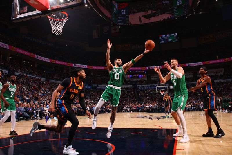 OKLAHOMA CITY, OK - JANUARY 5: Jayson Tatum #0 of the Boston Celtics rebounds the ball during the game against the Oklahoma City Thunder on January 5, 2025 at Paycom Center in Oklahoma City, Oklahoma. NOTE TO USER: User expressly acknowledges and agrees that, by downloading and or using this photograph, User is consenting to the terms and conditions of the Getty Images License Agreement. Mandatory Copyright Notice: Copyright 2025 NBAE (Photo by Zach Beeker/NBAE via Getty Images)