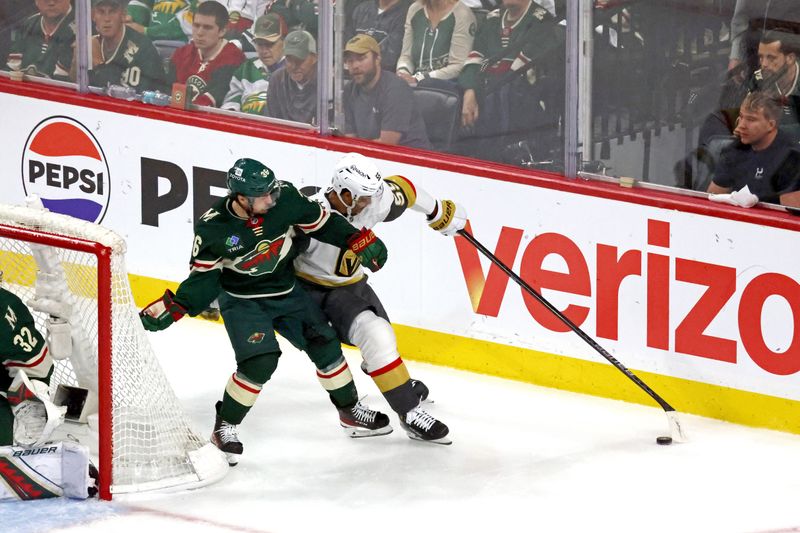 Apr 26, 2025; Saint Paul, Minnesota, USA; Minnesota Wild right wing Mats Zuccarello (36) battles Vegas Golden Knights right wing Keegan Kolesar (55) during the second period in game four of the first round of the 2025 Stanley Cup Playoffs at Xcel Energy Center. Mandatory Credit: Bruce Fedyck-Imagn Images