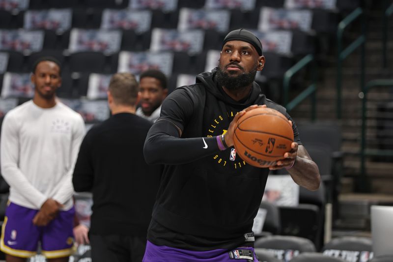 DALLAS, TX - JANUARY 7: LeBron James #23 of the Los Angeles Lakers warms up before the game against the Dallas Mavericks on January 7, 2025 at American Airlines Center in Dallas, Texas. NOTE TO USER: User expressly acknowledges and agrees that, by downloading and or using this photograph, User is consenting to the terms and conditions of the Getty Images License Agreement. Mandatory Copyright Notice: Copyright 2025 NBAE (Photo by Tim Heitman/NBAE via Getty Images)