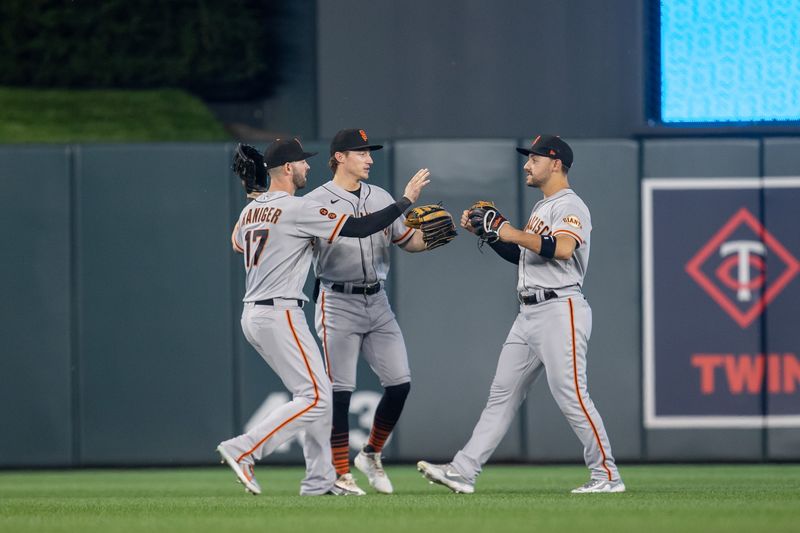 May 23, 2023; Minneapolis, Minnesota, USA; San Francisco Giants left fielder Mitch Haniger (17), center fielder Mike Yastrzemski (5) and right fielder Michael Conforto (8) celebrate after defeating the Minnesota Twins at Target Field. Mandatory Credit: Jesse Johnson-USA TODAY Sports