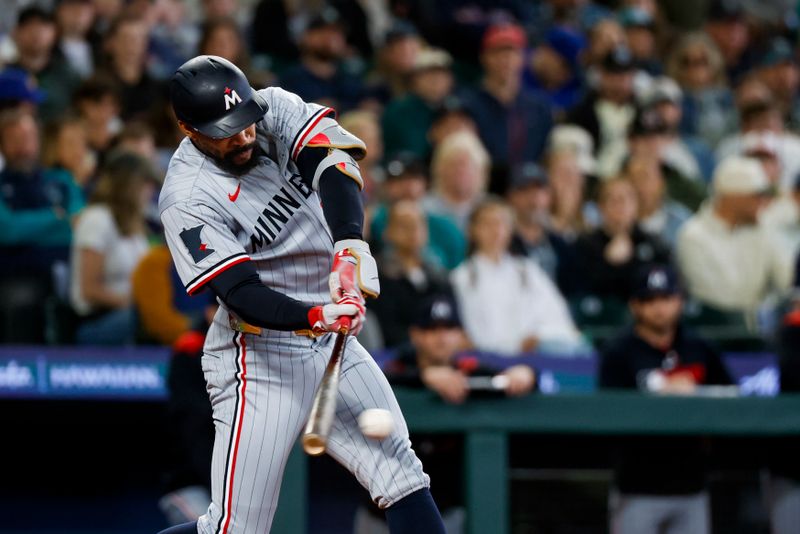 May 31, 2025; Seattle, Washington, USA; Minnesota Twins center fielder Byron Buxton (25) hits an RBI-single against the Seattle Mariners during the second inning at T-Mobile Park. Mandatory Credit: Joe Nicholson-Imagn Images