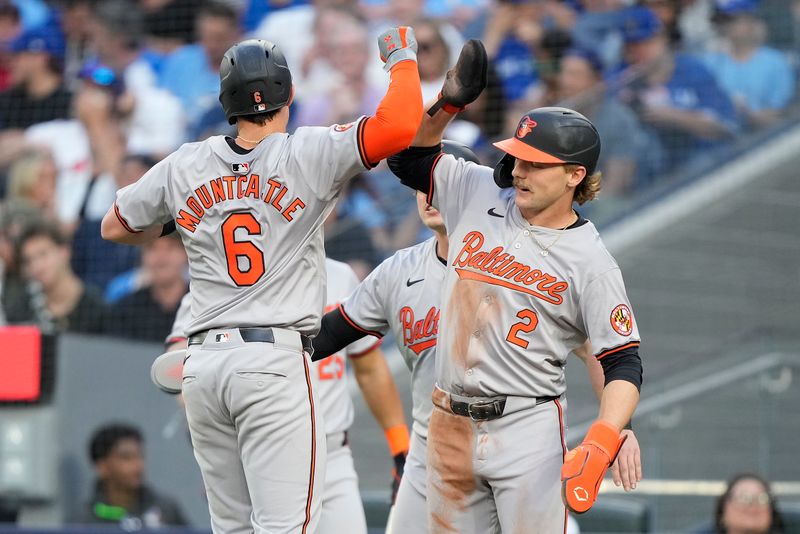 Jun 4, 2024; Toronto, Ontario, CAN;  Baltimore Orioles shortstop Gunnar Henderson (2) congratulates first baseman Ryan Mountcastle (6) on his three-run home run against the Toronto Blue Jays during the third inning at Rogers Centre. Mandatory Credit: John E. Sokolowski-USA TODAY Sports